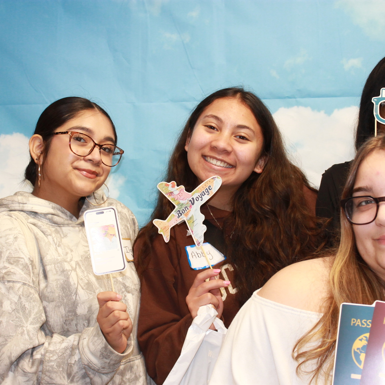 group of high school students taking part in the photobooth exhibit at World Language Day