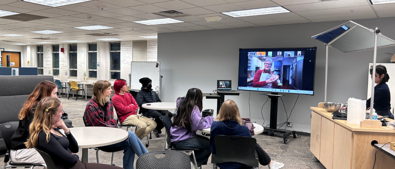students attending an event featuring cooking at the CLCL Culture Bites Cafe with an online speaker