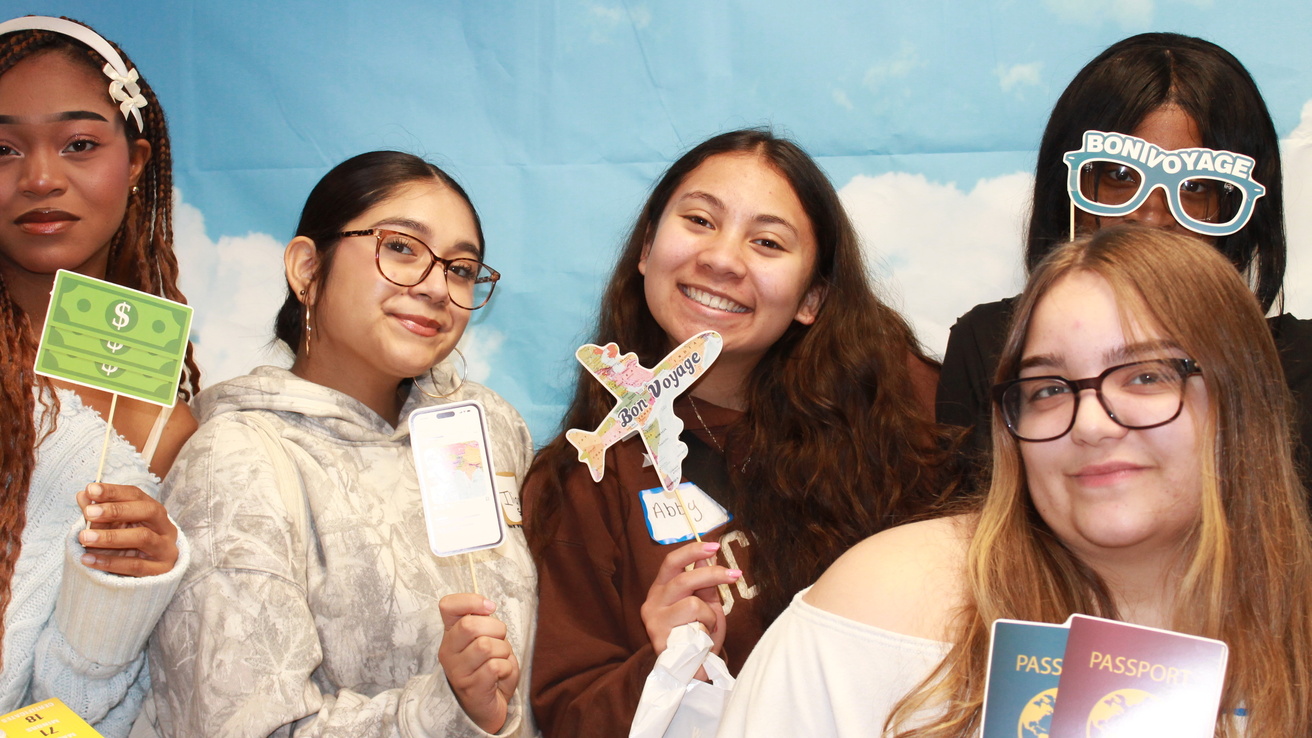 group of high school students taking part in the photobooth exhibit at World Language Day